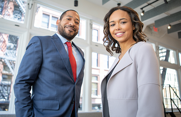 Businessman and businesswoman smiling